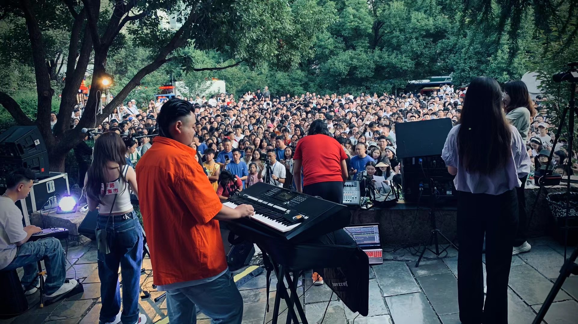 A crowd gathered in front of a live street concert